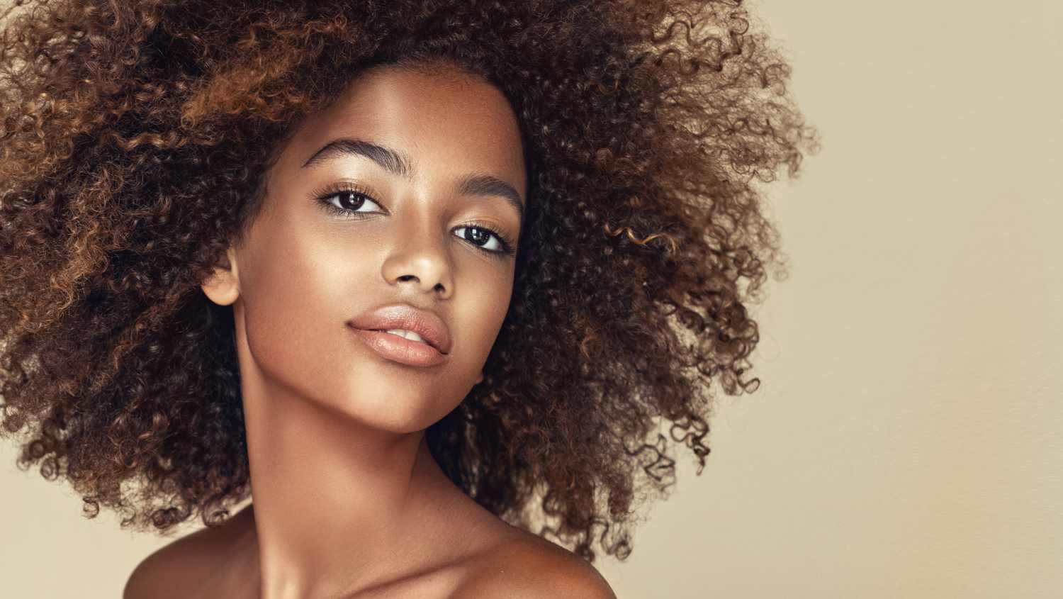 Woman with dark, curly hair